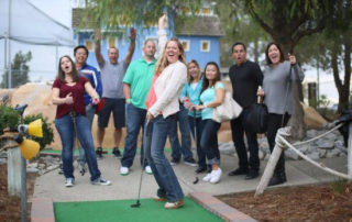 Adults and teens having fun at a group event at a family amusement center in Murrieta