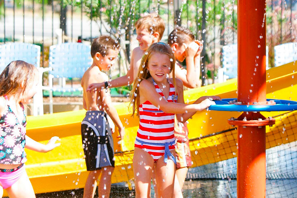 Outdoor water slides and splash zone at tourist attraction in Temecula, CA
