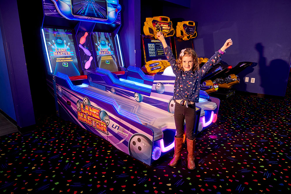 Girl celebrating after playing skee-ball at Temecula kids attraction