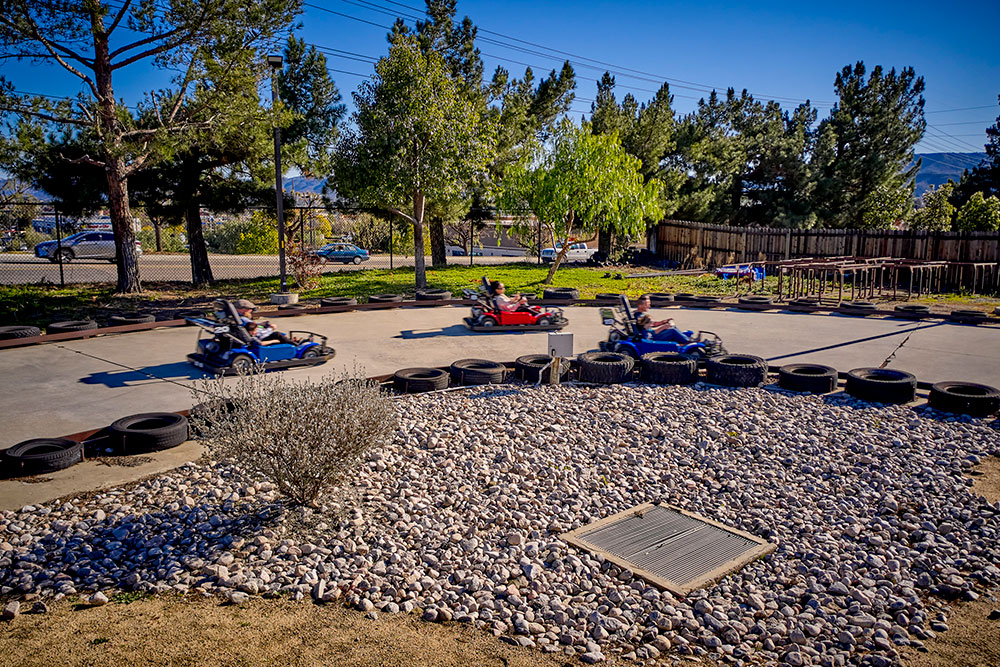 Families racing go-karts at kids attraction in Temecula