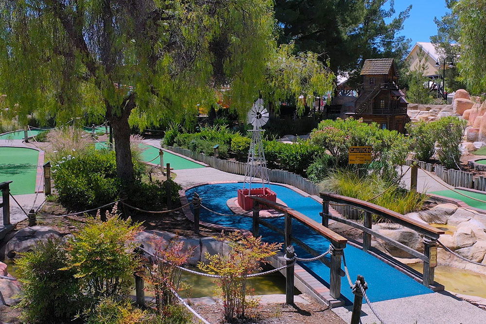 Outdoor splash pad and water slides at tourist attraction in Temecula CA