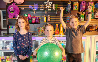 Children celebrating with prizes at Mulligan Family Fun Center in California