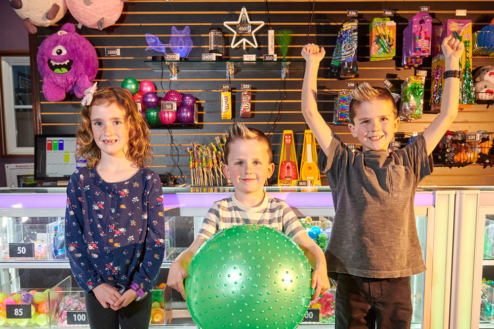 Children celebrating with prizes at Mulligan Family Fun Center in California