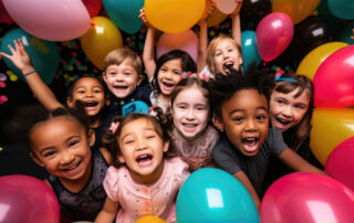 Cheerful children of different nationalities at a holiday, birthday party, balloons, friends, kids, congratulations, joyful emotions, diversity, playroom, kindergarten, toddler, gifts